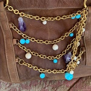 Leather shoulder bag with genuine gemstones